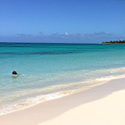 Caribbean Holidays, January Instagram Hotspots, Clear turquoise water, pale sand and a snorkeller at Playa Kenepa, Cura&ccedil;ao, under a vivid blue sky in January