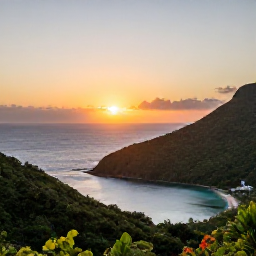 Caribbean Holidays, January Nature Holidays, A sunset over the Caribbean Sea viewed from a green hillside in St John, with a small coastal bay and warm evening light