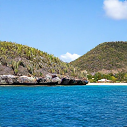 Caribbean Holidays, January Nature Holidays, Colourful Caribbean nature scene on Bonaire in January, with cactus-covered hills, clear blue water and a bright sky