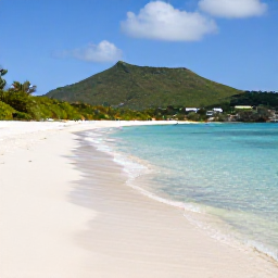 Caribbean Holidays, January Nature Holidays, Quiet white-sand beach at Anse Marcel on Saint Martin with clear shallow water, green hills and light January sunshine
