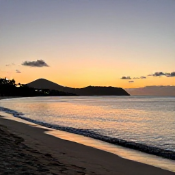 Caribbean Holidays, January Nature Holidays, Relaxed sunset on a quiet Saint Martin beach, warm sand, calm Caribbean sea and silhouettes of distant hills