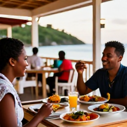 Caribbean Holidays, January Solo Holidays, Friendly solo traveller dining at an outdoor Caribbean restaurant in Saint Kitts, colourful local dishes and warm evening light