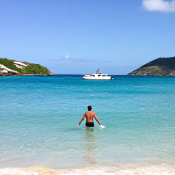 Caribbean Holidays, January Solo Holidays, Solo traveller swimming in clear turquoise water at Orient Bay, Saint Martin, sunny January beach scene with water sports