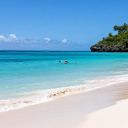 Caribbean Holidays, July Backpacking, Backpacker swimming and snorkelling in clear turquoise water beside a quiet white-sand beach in the Grenadines