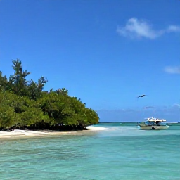 Caribbean Holidays, July Birdwatching, Peaceful turquoise sea and mangrove shoreline in the Turks and Caicos Islands, with a small boat returning from a birdwatching excursion