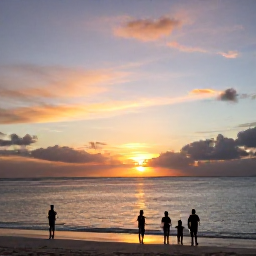 Caribbean Holidays, July Family Holidays, A vivid sunset over Grace Bay Beach with a family watching from the shoreline in the Turks and Caicos Islands