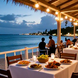 Caribbean Holidays, July Holidays, A colourful Caribbean evening at a beachfront restaurant on Saint Kitts, with local food, soft lights and views across the sea