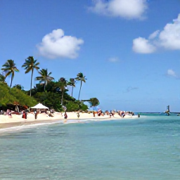 Caribbean Holidays, July Holidays, Sunny Caribbean beach on Saint Kitts with calm turquoise water, palm trees and visitors relaxing after a cultural festival