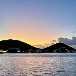 Caribbean Holidays, July Holidays, Sunset view over Marigot Bay and Philipsburg, showing the shared island&rsquo;s coastline, hills and evening lights