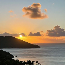 Caribbean Holidays, July Instagram Hotspots, Sunset over the Caribbean Sea from a scenic viewpoint in St John, United States Virgin Islands, with warm clouds and silhouetted hills