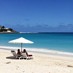 Caribbean Holidays, July Luxury Holidays, Beautiful Caribbean beach in Saint Martin with soft white sand, clear turquoise water and a couple relaxing under an umbrella