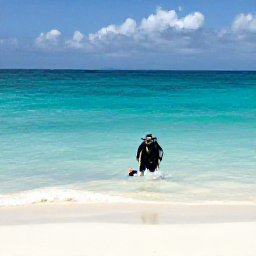 Caribbean Holidays, July Scuba Diving, Relaxed beach scene at Grace Bay with turquoise sea, white sand and a scuba diver's mask and fins after a July dive