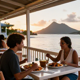 Caribbean Holidays, July Solo Holidays, Solo diner enjoying fresh Caribbean seafood at an outdoor waterfront restaurant in the United States Virgin Islands at sunset