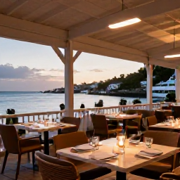Caribbean Holidays, July Spa Breaks, A stylish open-air restaurant in Gustavia, Saint Barth&eacute;lemy, with French-Caribbean food, harbour views and warm evening light