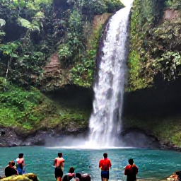 Caribbean Holidays, July Walking Holidays, Hikers approaching a clear waterfall and natural pool in Trinidad, surrounded by dense green forest and tropical vegetation