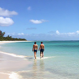 Caribbean Holidays, June Adults Only, A couple walking through shallow clear water at Grace Bay Beach in Providenciales during a sunny June afternoon