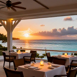 Caribbean Holidays, June Adults Only, Elegant open-air restaurant at sunset with tables overlooking the Caribbean sea in the United States Virgin Islands