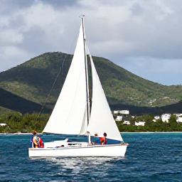 Caribbean Holidays, June Honeymoons, Couple sailing on calm Caribbean water with the green hills of Saint Martin in the background