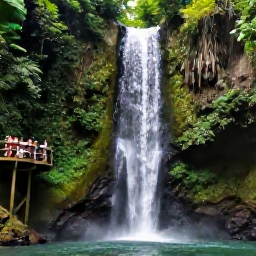 Caribbean Holidays, June Instagram Hotspots, A lush waterfall surrounded by tropical forest in Jamaica, with a wooden viewpoint and visitors enjoying the cool spray