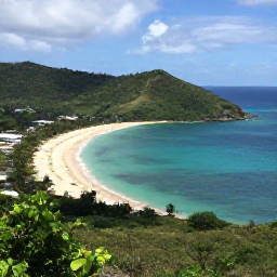 Caribbean Holidays, June Instagram Hotspots, Panoramic viewpoint over Magens Bay on St Thomas in June, showing a curved sandy beach, calm turquoise sea and lush green hills
