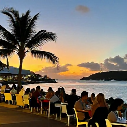 Caribbean Holidays, June Walking Holidays, A relaxed evening in Cruz Bay on Saint John, United States Virgin Islands, with walkers enjoying restaurants, harbour views and a colourful sunset