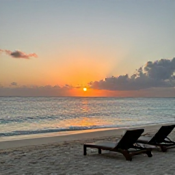 Caribbean Holidays, June Wellness, Peaceful sunset over a quiet Grenadines beach, comfortable lounge area, calm sea and warm evening colours