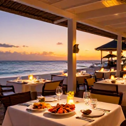 Caribbean Holidays, Luxury Aruba January, Stylish beachfront restaurant in Aruba at sunset, elegant table setting, fresh seafood and warm island lighting