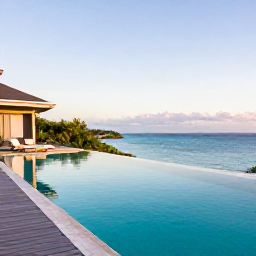 Caribbean Holidays, Luxury Caribbean Holidays, Private infinity pool overlooking a calm Caribbean bay at golden hour
