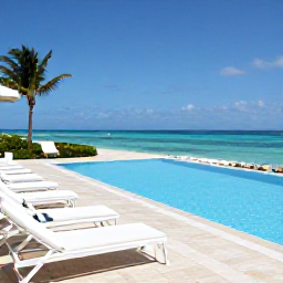 Caribbean Holidays, Luxury Caribbean November, Luxury Caribbean hotel terrace with private pool, white sun loungers and panoramic sea views under a clear November sky