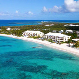 Caribbean Holidays, Luxury Holidays, Aerial view of turquoise water, white-sand beaches and elegant resorts across Providenciales in the Turks and Caicos Islands