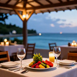 Caribbean Holidays, Luxury Holidays, Gourmet Creole dinner at an open-air Guadeloupe restaurant beside the sea, colourful local dishes and warm evening light