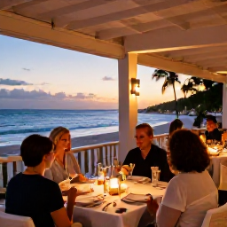 Caribbean Holidays, Luxury January Holidays, Elegant open-air restaurant beside a Dominican Republic beach, beautifully set table, candlelight and guests enjoying a relaxed evening meal