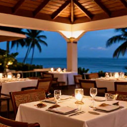 Caribbean Holidays, Luxury Trinidad Holidays, Outdoor dining at an elegant Caribbean restaurant in Trinidad and Tobago, local cuisine, candlelight and tropical evening setting