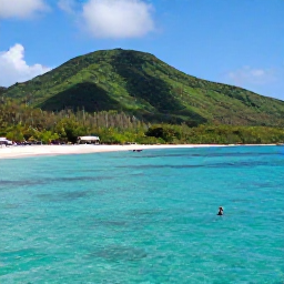 Caribbean Holidays, March Adventures, Visitors snorkelling in clear Caribbean water near a quiet beach on Nevis, with green hills in the background