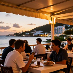 Caribbean Holidays, March Solo Holidays, Solo diner enjoying an outdoor Caribbean restaurant at sunset in Saint Martin, with local food and warm evening lights