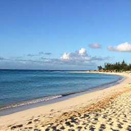 Caribbean Holidays, March Tours, A bright, relaxed morning at Grace Bay Beach in Providenciales, Turks and Caicos, with calm turquoise water, soft white sand and a few visitors enjoying the shore