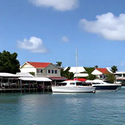 Caribbean Holidays, March Tours, Colourful waterfront in Marigot, Saint Martin, with market stalls, caf&eacute;s and boats in the bay