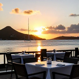 Caribbean Holidays, March Wellness, Relaxed Caribbean evening at a waterfront restaurant in the United States Virgin Islands, glowing sunset, outdoor tables and calm harbour