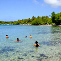 Caribbean Holidays, Martinique Beaches, Visitors swimming and snorkelling in clear shallow water at Anse Dufour, Martinique, with colourful fish and a green tropical coastline