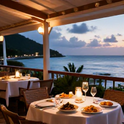 Caribbean Holidays, Martinique Honeymoon, Romantic Martinique restaurant terrace overlooking the sea, with Creole dishes, French wine and warm evening lights