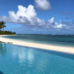 Caribbean Holidays, Martinique Luxury Holidays, Luxury beachfront resort in Martinique with an infinity pool, white sand beach and calm Caribbean Sea under a partly cloudy October sky