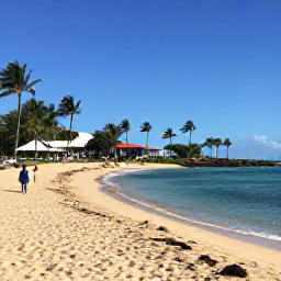 Caribbean Holidays, Martinique Spa Breaks, Golden sandy beach near a Martinique spa resort, calm turquoise water, palm trees and visitors enjoying a sunny February afternoon