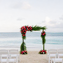 Caribbean Holidays, Martinique Weddings, Elegant small wedding ceremony on a quiet Martinique beach, white chairs, tropical flowers and calm Caribbean sea
