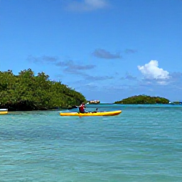 Caribbean Holidays, May Adventure Holidays, Kayakers paddling through calm turquoise water beside mangroves and low rocky islands in the Turks and Caicos