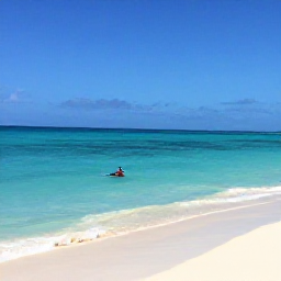 Caribbean Holidays, May Instagram Spots, Turquoise Caribbean sea, white sand and a snorkeller near Playa Kenepa Grandi, Cura&ccedil;ao, under a clear May sky