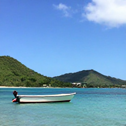 Caribbean Holidays, May Nature Holidays, A small boat on clear Caribbean water between Saint Kitts and Nevis, with green hills, blue sky and a relaxed island atmosphere