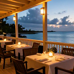 Caribbean Holidays, May Wellness Escape, Relaxed outdoor dining at a waterside restaurant in Turks and Caicos during a warm May evening
