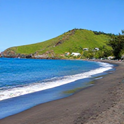 Caribbean Holidays, Montserrat Beach Holidays, Quiet Caribbean beach on Montserrat with dark volcanic sand, turquoise water, green hills and a clear blue sky