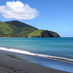 Caribbean Holidays, Montserrat Beach Holidays, Quiet tropical beach on Montserrat in August, with dark volcanic sand, turquoise Caribbean water, green hills and a relaxed holiday atmosphere