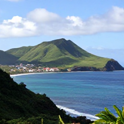 Caribbean Holidays, Montserrat in March, A sunny coastal view of Montserrat in March, with green volcanic hills, calm blue sea and a small fishing village
